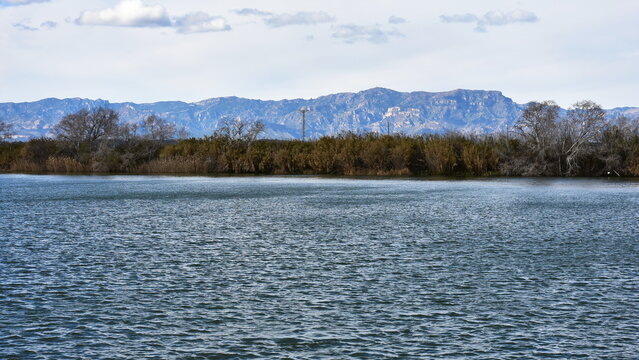 wide river Ebre near town Amposta in Spain