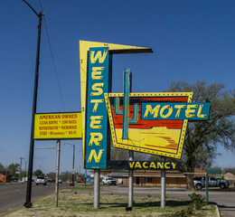 flashy motel sign on side of road
