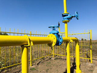 Yellow Gas Pipes with Blue Gate Valves