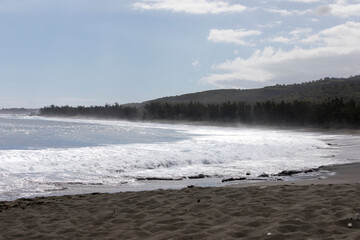 A photo of beach with black sand