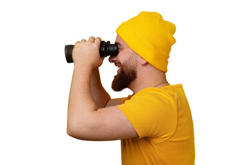 smiling man standing in profile and looking into binoculars isolated on transparent background
