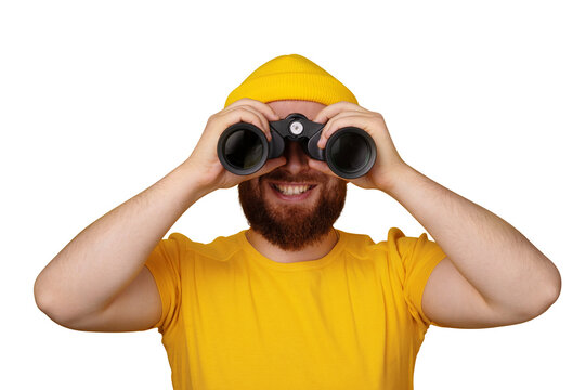 smiling man looking into binoculars isolated on transparent background