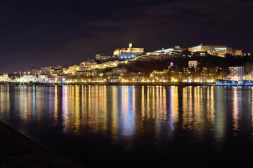 View of Coimbra at night over the mondego river