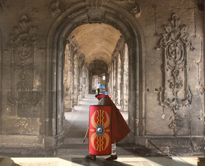 Roman solder walking past a ancient corridor