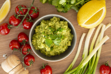 Homemade bowl of guacamole dip with fresh ingredients - 760801515