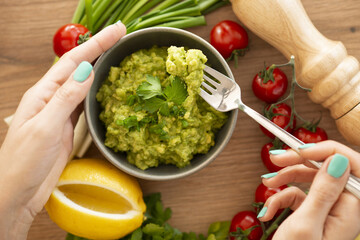 Homemade bowl of guacamole dip with fresh ingredients - 760801529