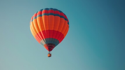 Fototapeta premium Hot Air Balloon Soaring in Blue Sky
