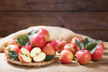 fresh red apples with leaves on wooden table - 760815140