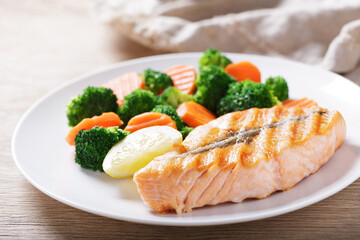 close up of plate of grilled salmon and vegetables - 760815369
