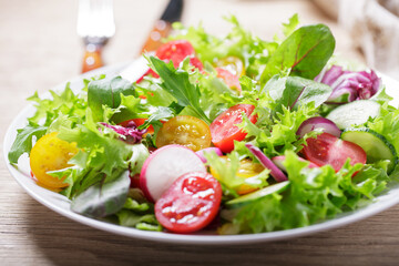 plate of green salad with fresh vegetables - 760815723