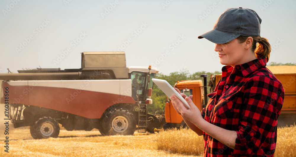 Aufkleber farmer with digital tablet on a background of harvester. smart farming concept.