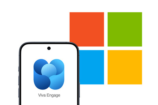 Viva Engage Logo is displayed on a modern smartphone, enterprise social networking service that is part of the Microsoft 365 family of products, Microsoft logo in the background, Yammer, communicate