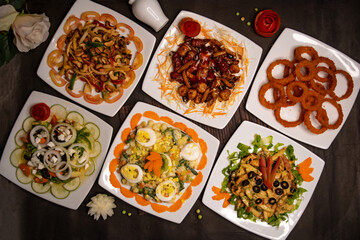 chicken vegetable cashew nut salad, classic Greece salad, russian salad, grilled chicken salad, munchies and fried onion rings