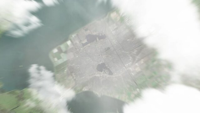 Earth zoom in from space to Almere Stad, Netherlands. Followed by zoom out through clouds and atmosphere into space. Satellite view. Travel intro. Images from NASA