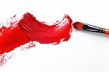 A red brush stroke on a white background. The brush is being used to paint a red line