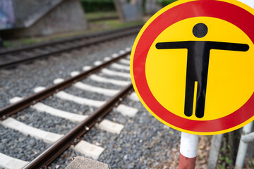 Danger sign for people on the railway track