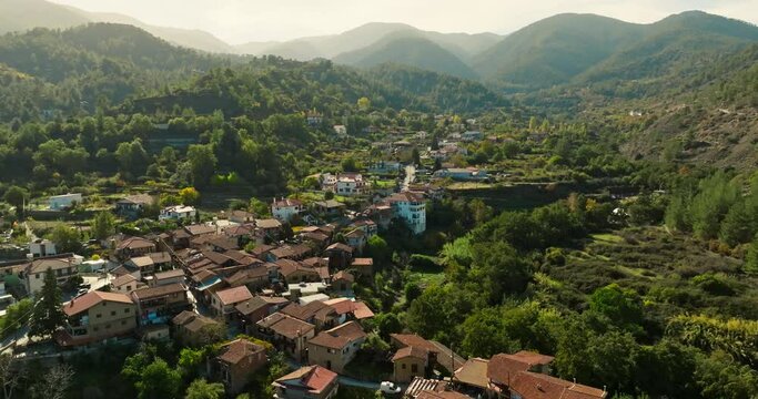 Aerial view Kakopetria Cyprus cityscape. The village is located between mountain ranges, a tourist spot in the Mediterranean of Europe. High quality 4k footage