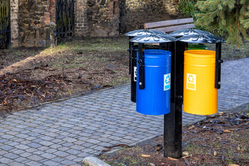 A beautiful set of bins for sorting garbage in the park.