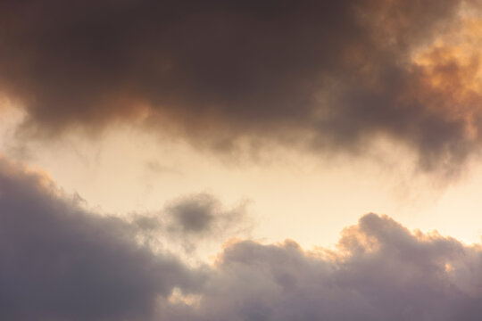 evening sky in orange glow. huge fluffy clouds. dramatic natural background