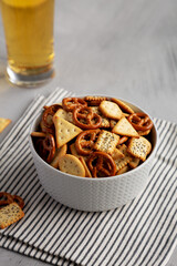 Homemade Cracker Snack Mix with Pretzels in a Bowl, side view.