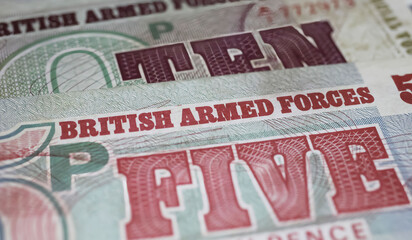 Closeup of old historical British Armed Forces banknotes  (focus on center)