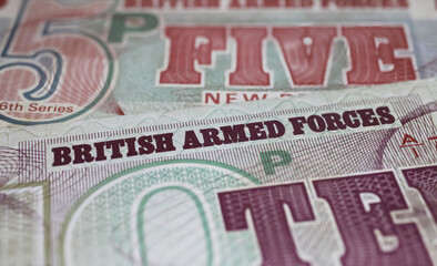 Obraz premium Closeup of old historical British Armed Forces banknotes (focus on center)