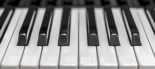 Detailed monochrome close up of piano keyboard with black and white keys for visual appeal