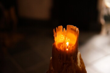 Burning Bee's Wax Candle with drippings