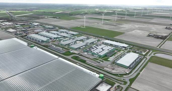 Large scale datacenter aerial drone view at Agriport, Middenmeer, The Netherlands. In the cloud, Artificial Intelligence AI applications and Data traffic infrastructure in The Netherlands. Aerial