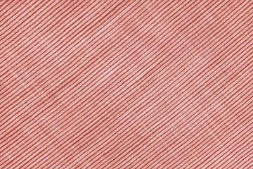 Natural linen texture as background, red cotton fabric with diagonal line striped pattern, texture...