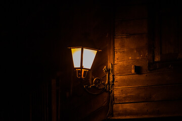 Old lantern in city street at night