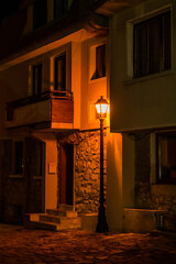 Old lantern in city street at night