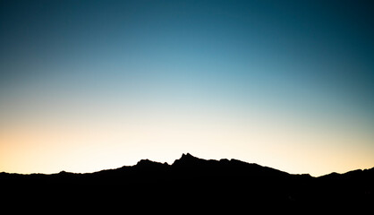 sunset over the mountains silhouette