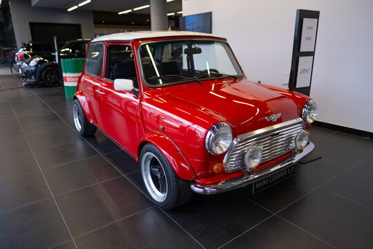 vintage Red Classic Rover MINI Cooper 1.3 Oldtimer in showroom, iconic design technology, retro-style, Automotive Industry, Frankfurt, Germany - January 21, 2024