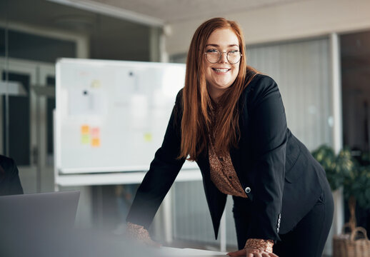 Young Executive Female With Beautiful Long Red Hair Laughing While Giving An Office Whiteboard Presentation 