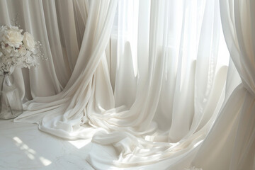 Bright and airy room filled with flowing white curtains