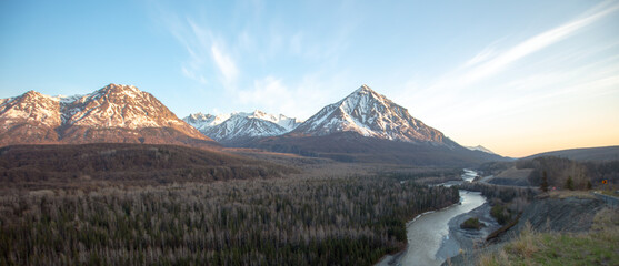 Blue sky over Matanuska River flowing  past Chugach Mountains near Palmer Alaska United States