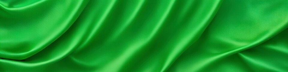 Light green panoramic silk fabric background in bright pastel colors with blurred satin wavy texture.