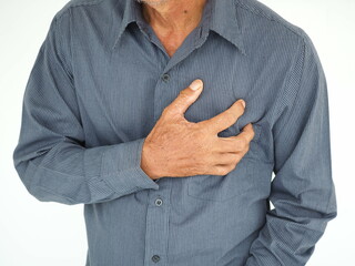 Man holding chest from pain. Heart attack symptom. Medical and health concept.