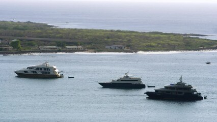 Three large touristic boats parked near the beach in Ecuador. - Powered by Adobe