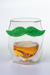 A glass with a mustache on it