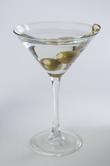 Chilled gin martini with bleu cheese stuffed olives