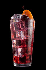 A glass of red drink with ice cubes and a cherry on top