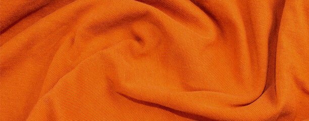 orange crinkled cotton fabric. background or textura
