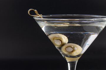 Chilled vodka martini with bleu cheese stuffed olives - Powered by Adobe