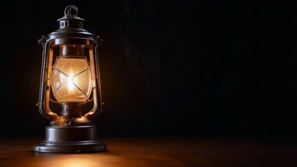 Close up light kerosene lamp equipment in dark space, vintage lantern, banner with copy space. concepts: day of light, lamp day, hope, guidance, nostalgia, warmth, solitude, light in darkness