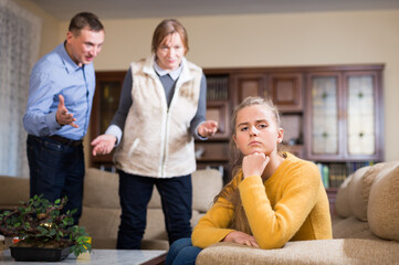 Offended girl after quarrel with parents sitting at home