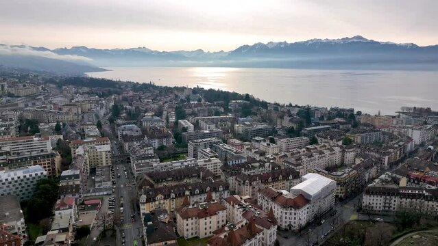 aerial view panorama of Lausanne, lake and mountains in the background. Switzerland