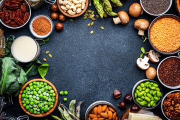 Vegan food background with empty space. Plant protein., vegetarian nutrition sources. Healthy eating, diet ingredients: legumes, beans, lentils, nuts, soy milk, tofu, cereals, seeds and sprouts.  - obrazy, fototapety, plakaty