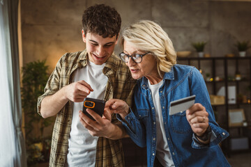 mother and son woman young man shopping online at home use credit card